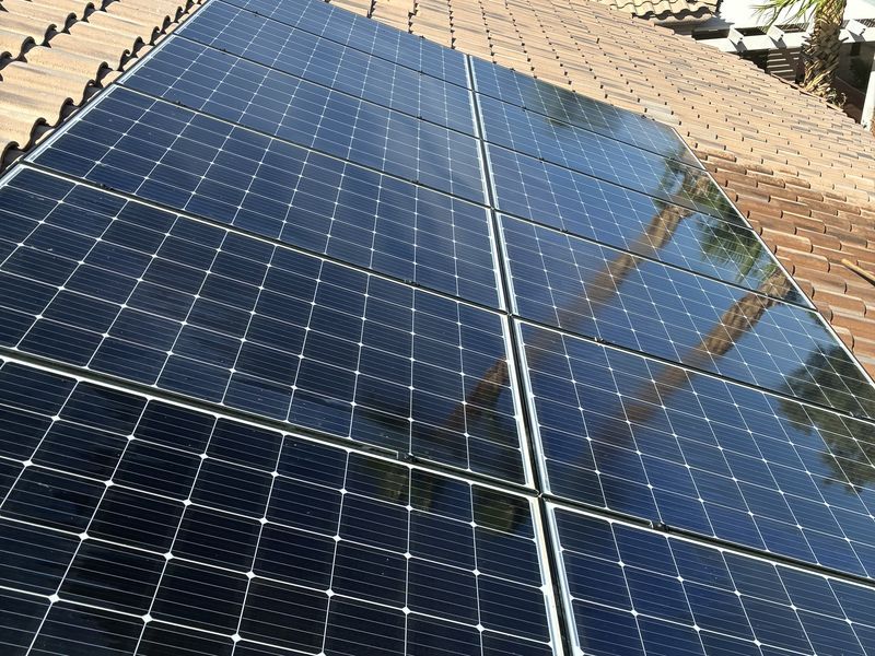 Solar panels on a tile roof, after